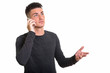 © Ranta Images - Studio shot of young handsome man talking on mobile phone while