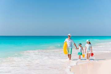 Happy beautiful family on a tropical beach vacation