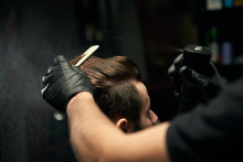 Crop Of Barber Hands Making New Haircut For Male Client