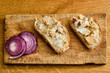 Bread with lard and greaves on cutting board