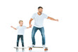 © LIGHTFIELD STUDIOS - positive father and cheerful son riding penny boards and holding hands isolated on white