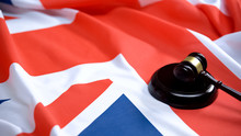 Gavel Lying On Sound Block Against British Flag, Parliament Decision, Justice
