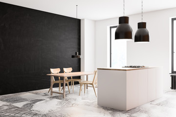 White and black kitchen corner with dining table