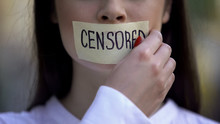 Woman Taking Off Tape With Censored Word Over Mouth, Democracy Concept, Freedom