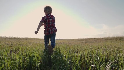 happy family little boy a runs concept slow motion video. happy child girl with sunset nature outdoo