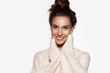 © deniskomarov - Pretty girl portrait posing isolated on white background with shiny skin. Beautiful brunette model in knitted pullover smiling. Beauty and positivity concept