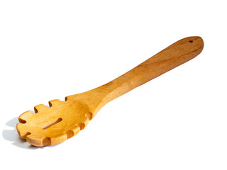 Wooden spaghetti server isolated on a white background.