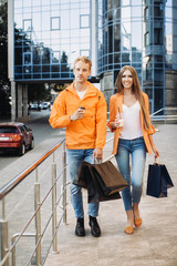 Sticker - Happy friends walking with bags after Black Friday shopping