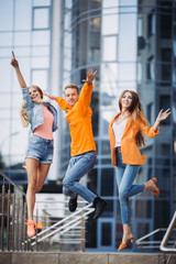 Wall Mural - Happy friends walking with bags after Black Friday shopping