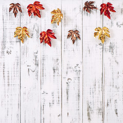 Canvas Print - red golden leaves bright wooden background autumn