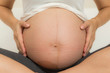 © pushish images - Belly pregant woman close up