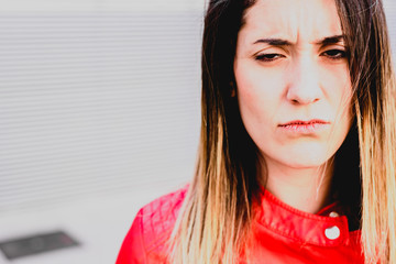 Portrait of independent young woman with serious, thoughtful and worried face.