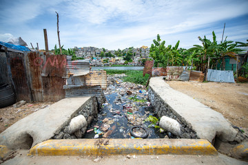 Santo Domingo, La Altagracia / Dominican Republic - May 15 2018: Aqueduct Full Of Garbage And Waste by the Ozama River in Poor Los Guandules Neighborhood