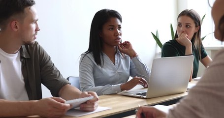 Wall Mural - African asian businesswoman mentor talking at multiracial group meeting table