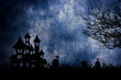Halloween night scene with haunted house and death tree background.