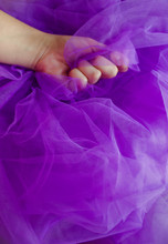 Girl's Hand Lies On A Purple Tulle. Creative Background. Seamstress. Copy Space, Top View, Flat Lay