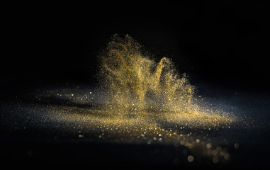Wall Mural - glitter lights grunge background, gold glitter defocused abstract twinkly gold lights background.