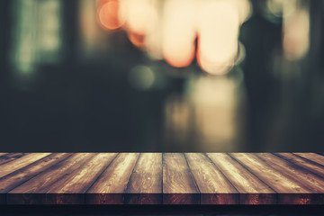 Poster - Wooden table with blur bokeh cafe restaurant backgrounds, for display products