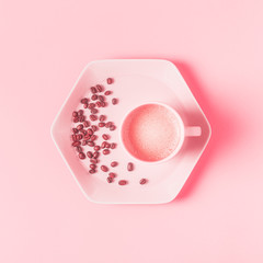 Wall Mural - Cup of coffee on a pink pastel background.