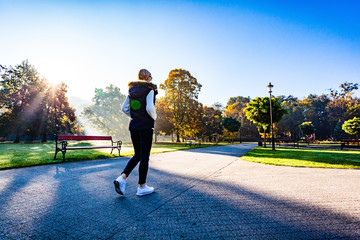 Wall Mural - middle-aged woman walking in city park
