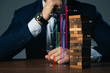 © whyframeshot - caucasian businessman hand touch wooden block successful business  organize strategy growth ideas concept