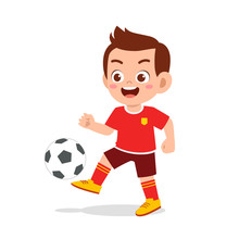 Cute Kid Boy Play Soccer As Striker