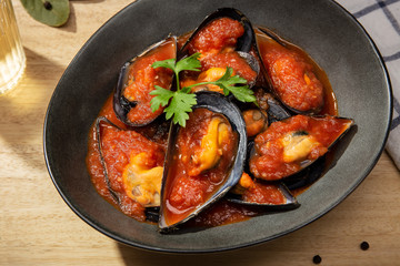 Wall Mural - Cooked mussels with hot spiced sauce