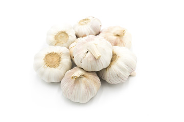 Wall Mural - Stacked garlic roots closeup isolated on white background