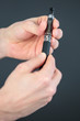 © auremar - closeup of hands holding electronic cigarette