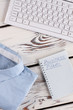 © DenisProduction.com - Office table detailed. Keyboard, planner and shirt close up. Office concept.