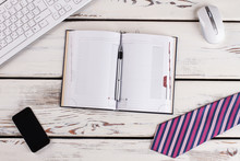 Office Man Pack. Purple Tie, Smartphone And Planner With Pen Above.