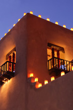 Adobe Building In Santa Fe At Christmas Lit Up With Farolitos