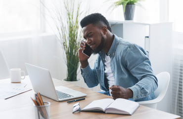 Wall Mural - Portrait of stressed african american businessman having problems at work