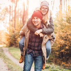 traveler couple in love so fun in the forest. concept of trekking, adventure and seasonal vacation.