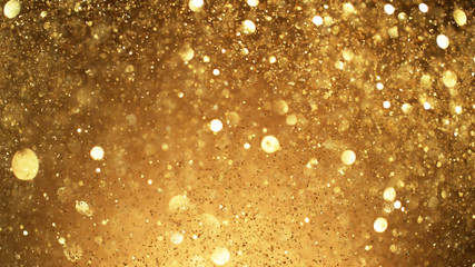 Abstract golden glittering background with blur dots.