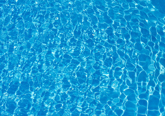  Blue pool water with sun reflections