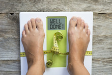 Diet Motivation Message On Weight Scale Suggesting Losing Kilogram Success