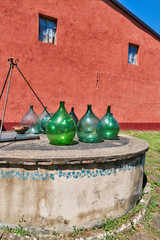 Water well with empty old wine jars. Tuscany, Italy.