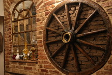 Old Wooden Wheel On The Wall