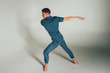 © Skripnik Olga - shot of mad, crazy, cheerful, successful, lucky guy in casual outfit, jeans, jumping with hands up,triumphant, gesturing against white background