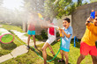 © Sergey Novikov - Very happy boy with sprinkler in water gun fight