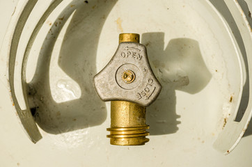 Overhead close-up of a propane tank and valve