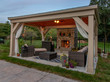 Cabana / lounge outdoor with fire in fireplace creating a relaxed ambience