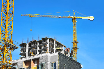 Crane and highrise construction site