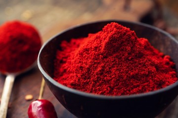 Close up still life of red chilli powder, selective focus