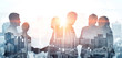 Leinwandbild Motiv Double exposure image of many business people conference group meeting on city office building in background showing partnership success of business deal. Concept of teamwork, trust and agreement.