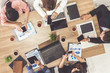 © InfiniteFlow - Top view of businessman executive in group meeting with other businessmen and businesswomen in modern office with laptop computer, coffee and document on table. People corporate business team concept.