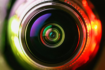 Wall Mural - Close-up camera lens with yellow and red backlight. Optics. Gorizontal photo