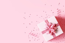 Gift Box With Confetti On Pastel Pink Background. 3d Rendering