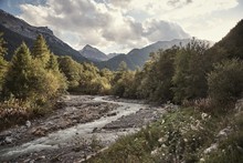 Horizontal Shot Of Brook Of St. Maria Val MÃ¼stair, Engadin, Switzerland Under The Cloudy Sky